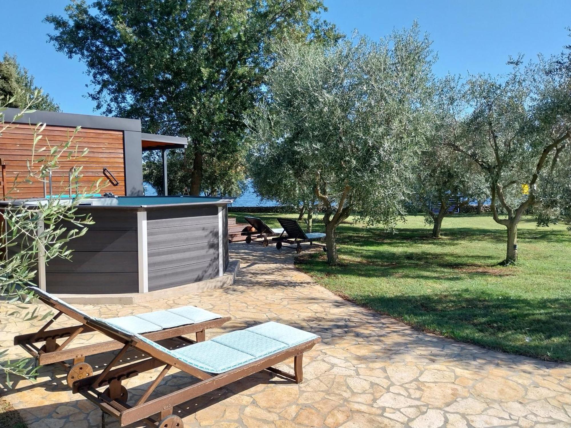 Beach House Ive: Coastal Retreat with Jacuzzi, Pool and Olive Grove Pomer Exterior photo